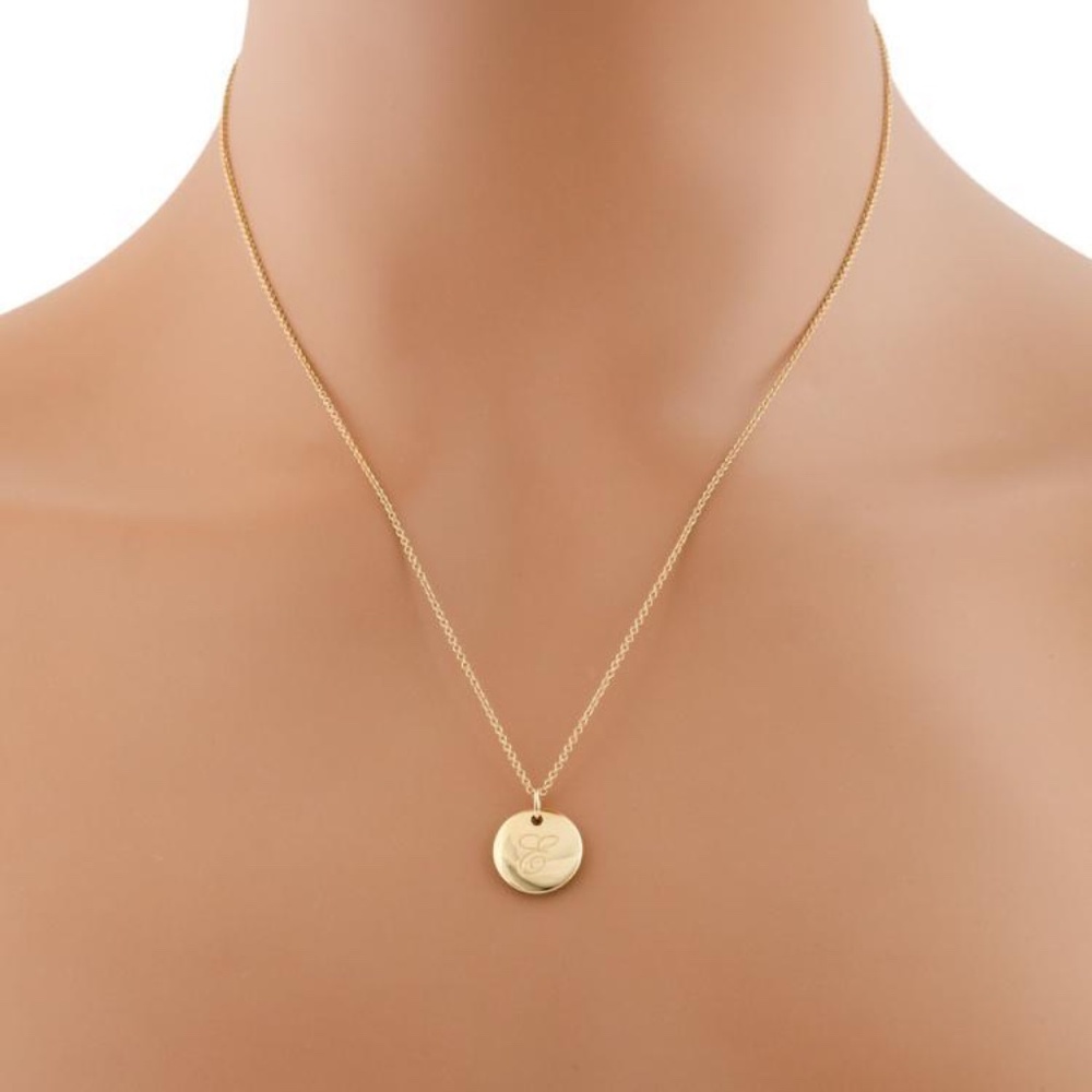 Tiffany Notes letter "J" Disc Round Pendant in 18K yellow gold